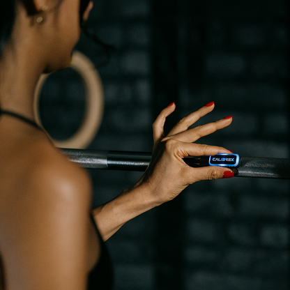 Person Attaching Calibrex To A Barbell